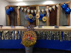 a decorated table with blue and gold decorations