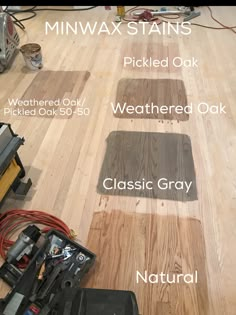 wood flooring with different types of paint and tools