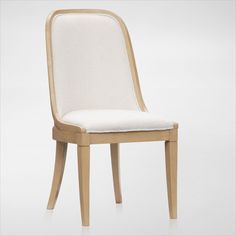 a chair made out of wood and upholstered with white fabric on the seat