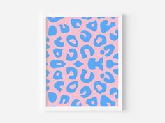 a pink and blue leopard print on a wall