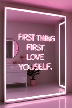 a pink neon sign that says, first thing first love yourself