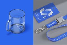 a glass mug with a lanyard and keychain attached to it next to a plastic card holder