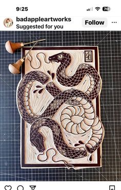 an image of a wooden puzzle with a snake on it