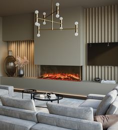 a living room with couches and a fire place in the middle of the room