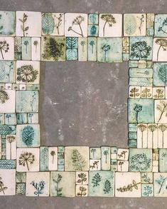 an artistic tile design with trees and plants on it's sides, in the shape of a square