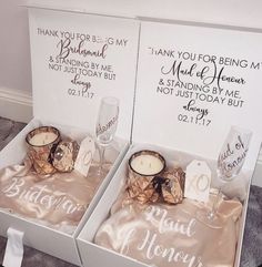 two boxes with wedding gifts in them sitting on the floor next to eachother