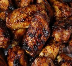 closeup of chicken wings with brown sauce on them