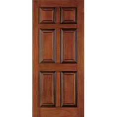 a wooden door with four paneled panels