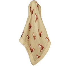 a white and brown towel with horses on it