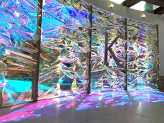 an art installation is shown in the middle of a room with light coming through it