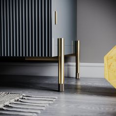 a yellow umbrella sitting on top of a wooden floor next to a radiator