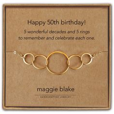 a birthday card with three rings on it