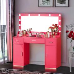 a bright pink vanity with lights on it