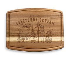 a wooden cutting board with the words everybody scream on it and an image of cartoon characters