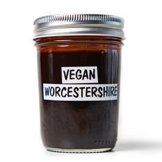 a jar of vegan worcestershine on a white background