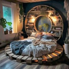 a bed made out of wooden pallets in a room with bookshelves and plants