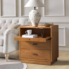 a living room scene with focus on the end table and coffee cup sitting on it