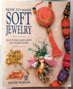 the book how to make soft jewelry is shown with beads and other items on it