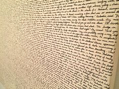 a wall with writing on it in an office