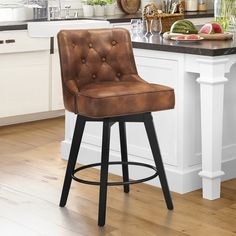 a brown leather bar stool sitting on top of a kitchen counter