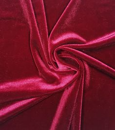 a close up shot of a red velvet fabric