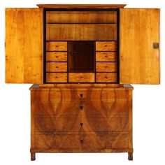 an old dresser with its doors open and drawers on the top, sitting against a white background