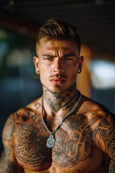 a shirtless man with tattoos on his chest and neck is looking at the camera