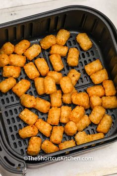 tater tots are being cooked in an air fryer