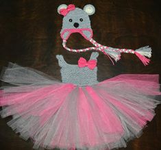 a crocheted teddy bear hat and pink tutu skirt