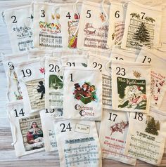 twelve christmas tea towels with numbers and pictures on them, all in different styles or designs