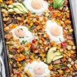 two fried eggs and avocado are on top of a casserole dish