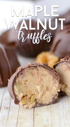 a close up of a half eaten chocolate covered candy with the words maple walnut truffles in the background