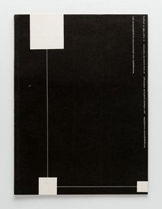 a black and white book with two rectangles on the cover, one in front of it