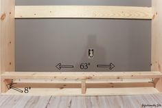 the measurements are displayed for this diy shelving unit, which has been built into an unfinished wall