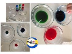 four different colors of liquid in glasses with markers on the bottom one is red, green and blue