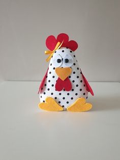 a stuffed chicken with polka dots on it's head