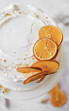 there is a cake with orange slices on it