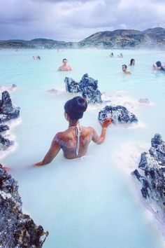 people are in the blue lagoon with white water