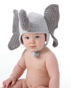 a baby wearing a crocheted hat with ears