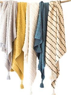 towels hanging on a clothes line with tassels