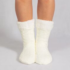 The is a super soft ONE SIZE FITS MOST pair of slipper socks that keep your feet cozy and comfortable. With a thick flannel fleece outer lining and premium sherpa fleece on the inside, theyll keep your feet toasty warm, even on the coldest floors. 100% cruelty-free. Get yours today! Package：A pair of socks Soft Indoor Socks For Winter, Cozy Super Soft Indoor Socks, Cozy Warm Socks For Indoor, Cozy White Slippers With Plush Lining, Warm Cozy Socks For Indoor Use, Cozy Warm Socks For Indoor Use, Soft Comfortable Indoor Socks, Soft Snug Socks For Indoor Use, Soft Snug-fit Socks For Indoor Use