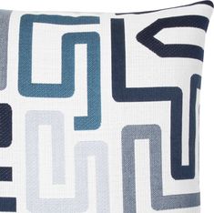 a blue and white pillow with an abstract design