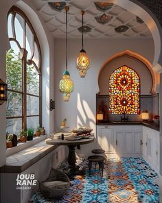 an ornate kitchen with stained glass windows and chandeliers hanging from the ceiling above