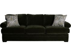 a black couch with two pillows on the back and one pillow on the top of it