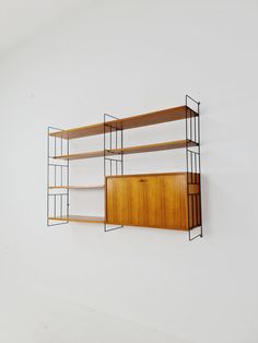 a wall mounted shelf with two open shelves