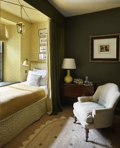 a bedroom with green walls and yellow curtains