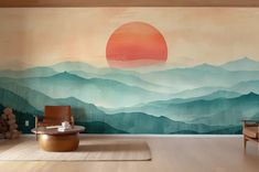 a living room with mountains painted on the wall