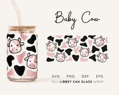 a baby cow pattern on a pink and black glass with straw in the bottom, next to it's lid