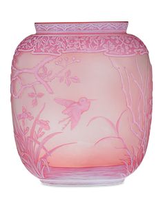 a pink vase with a bird and flowers painted on the side, in front of a white background