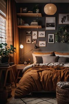 a bed sitting in a bedroom next to a window with pictures on the wall above it